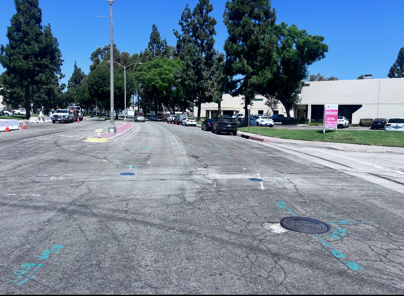 Core Cap installed flush in active roadway with utility locator markings