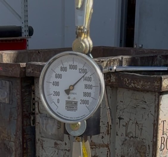 Dynamometer gauge showing 1,300 lbs uplift force during Core Cap pull test